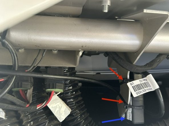 Use 2 cable ties to mount the GO device to the bracket near the middle of the dash as shown.  Making sure that the serial number side is facing out away from the metal bracket..