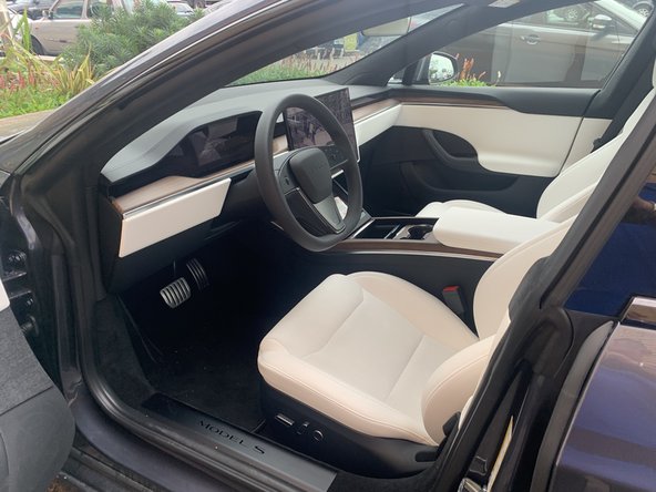 The Tesla connector is located below the touch screen in the centre console.