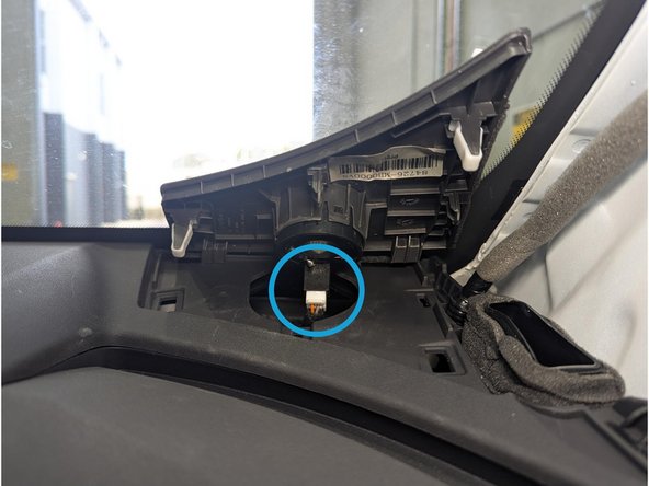 Using a plastic panel removal tool, detach the speaker cover (on both sides) which is held by plastic fasteners.