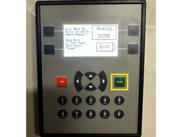 Using the open button on the front of the control panel, run the door to the desired open position.