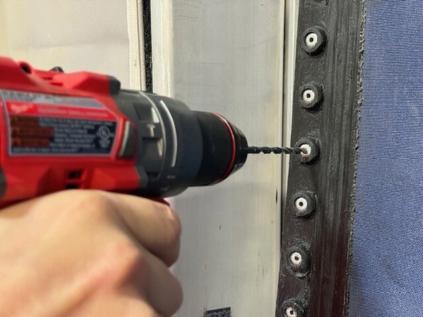 If the curtain tag assembly has not fallen completely out, you will first need to remove the existing rivet and curtain tag pair in question. You may need to drill out the head of the rivet on the backside of the curtain using a 1/8in drill bit.