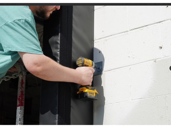 Orient the Side Pad so the bottom face of the Side Pad is flush with the bottom face of the door opening. Use the reference lines drawn in step 1 to make sure the outside edge of the Side Pad plumb with the reference lines.