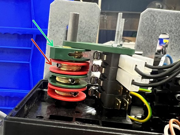 Underneath, there is (2) Green Limit Cams, and (2) Red Limit Cams in Alternating Order.