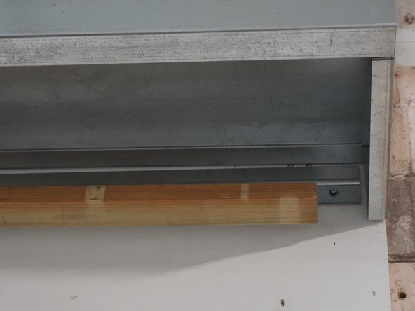 Using a Fork Lift or some other source for lifting the roof up, gently hang the Roof assembly by interlocking the back lip of the Roof onto the Roof Mounting Cleat.