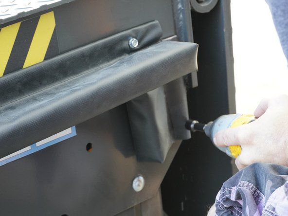 Orient the Front Seal (5-1/2" Long) on the side of the Dock Leveler with the Aluminum Bar Stock right behind the front lip of the Dock Leveler and just below the Upper Seal.