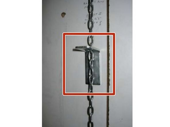 Mount the Chain Bracket to the building Wall directly below the Release-Chain at a  convenient Elevation (usually about 4’ from the floor). Route the Release-Chain through the  Keyhole Slot.