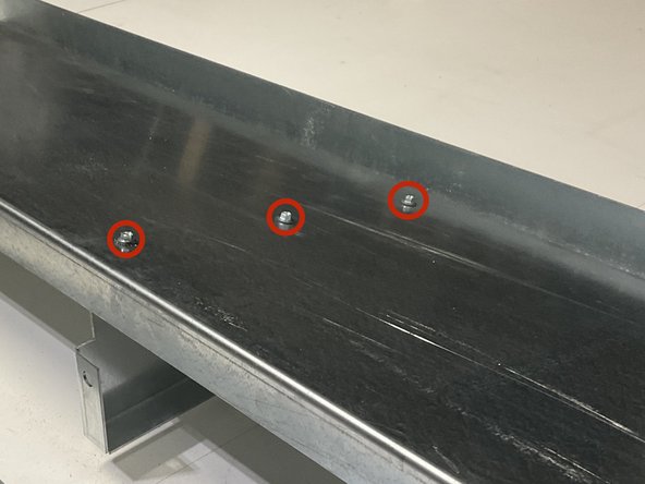 Line up the (2) Center Gussets with the pre-drilled holes in the Roof Panel.