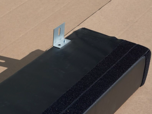 Using the provided Hex Head Screws, attach Angle Brackets on the inside and outside edges of the side pads. There will be one bracket 8&quot;-12&quot; from the top and bottom edges, and one centered as shown.