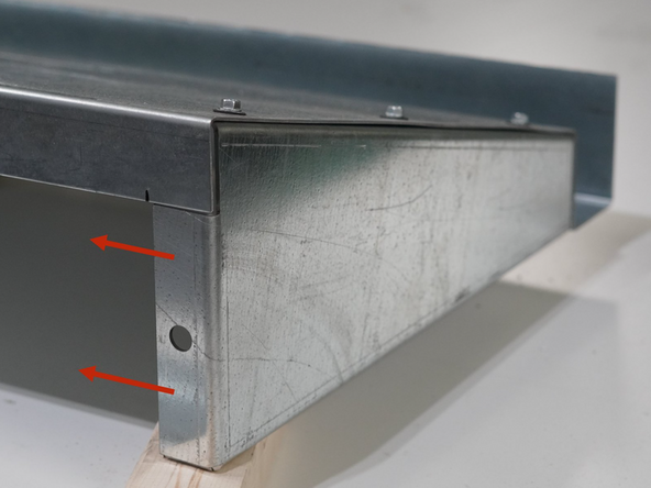 Orient the Roof Panel with the gutter facing up and line up the Left Side Gusset under the left edge of the Roof Panel.