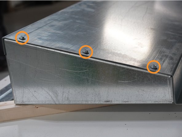 Be sure the mounting flange is facing towards the center of the Roof Panel and the top pre-drilled holes are aligned with the Gusset and the Roof Panel.