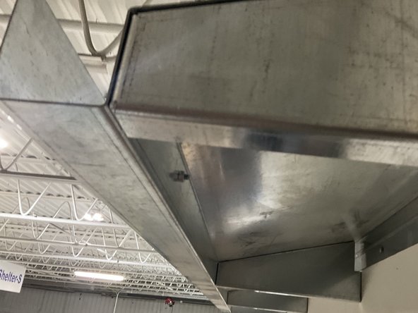 Fasten one end of the Aircraft Cable to the inside of the gutter by taking the Bolt and Washer through the pre-drilled hole on the inside face of the gutter located roughly 12&quot; from each end and attach the nut on the backside.