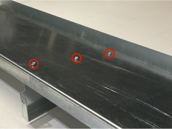 Line up the (2) Center Gussets with the pre-drilled holes in the Roof Panel.