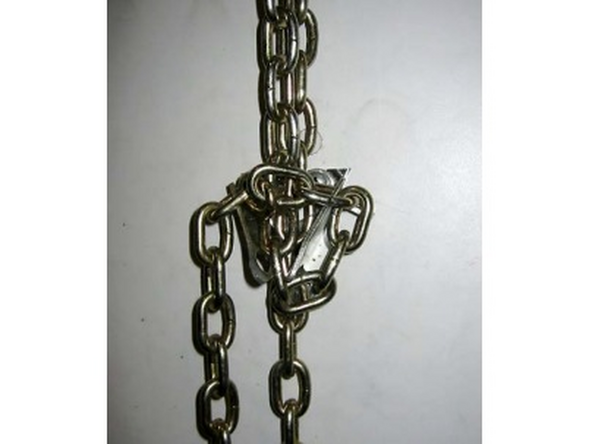 Route the Hoist Chain over the Hoist Chain Sprocket (Image 2).