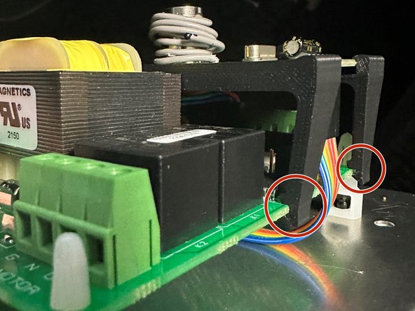 There are Slots in the (4) Feet of the Receiver Mount that Grip on the Sides of the Controller PCB.