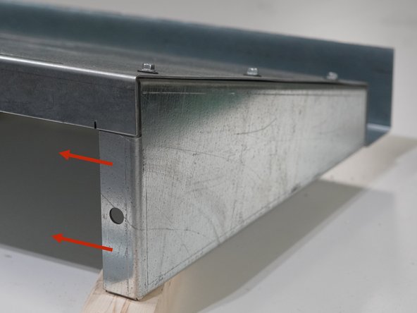 Orient the Roof Panel with the gutter facing up and line up the Left Side Gusset under the left edge of the Roof Panel.