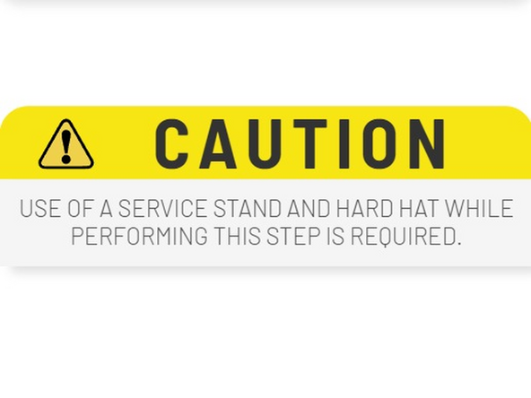 Carefully shift the leveler so that it sits tight up against the steel frame at the back of the pit.