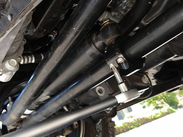 With the clamp in the correct position along the length of the tie rod, make sure the clamp is rotated into a position that prevents the damper mounting hardware from binding.