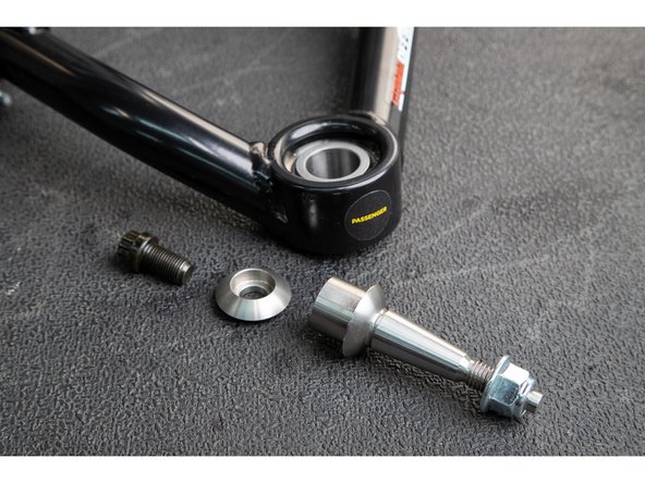 Install the taper adapter up from the bottom into the uniball. The tapered pin should point down, towards the spindle.