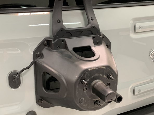 Hold the flanged nylock nuts with a 10mm wrench and torque the provided M6 screws to approximately 9 lb-ft [12 Nm].