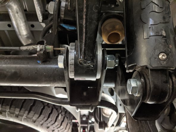 The stock bolts for the rear lower control arms are 21mm for the bolt head and 24mm for the nut.