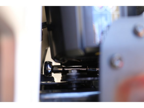 Hand tighten the nuts on the backside of the bumper. It can be helpful to move the bumper slightly to gain access to the studs. It is easier to get the inside lower nuts on from below the vehicle.