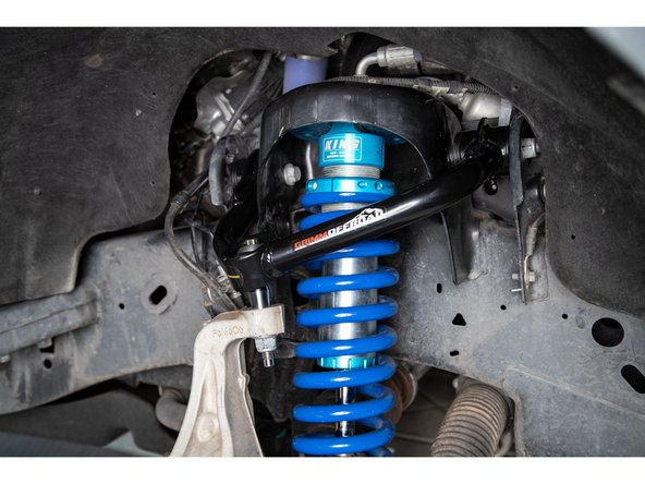 A second option is to remove the control arm and pin assembly from the frame and install the tapered pin into the spindle first, then use the leverage from holding the control arm to re-orient the pin and line up the mounts at the frame.