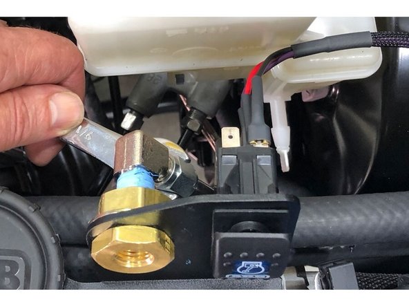 Install the other end of the included Stainless Steel Pressure Hose on to the brass bulkhead fitting on the Controls Plate.