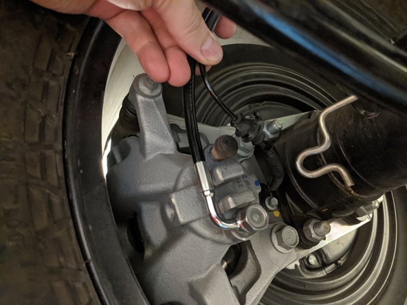 The wheel speed sensor wire can be unclipped from the axle side bracket to give it more slack.