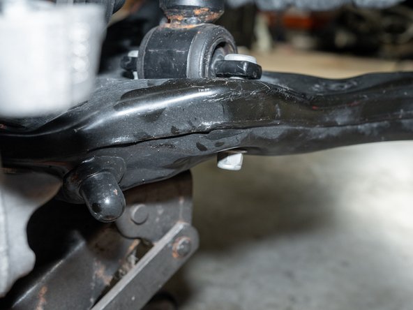 Use the factory hardware to secure the top of the struts, but do not yet tighten.