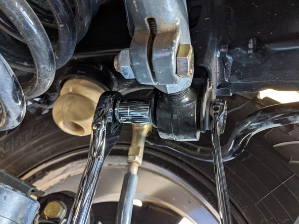 Move onto the rear axle side track bar mount