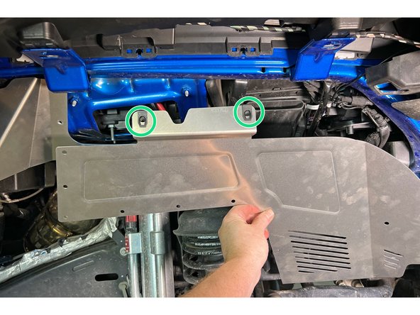 Install two of the clip barrel nuts onto the front inner fender liner section as shown.