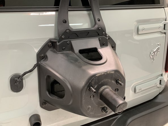 Reattach the 3rd brake light mount to the Grimm OffRoad extension bracket. Note that the mounting holes key into place.