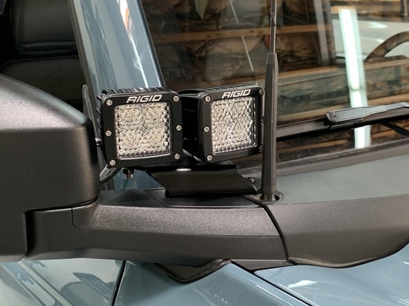 Attach lights to the mounting brackets following light manufacturer's instructions.