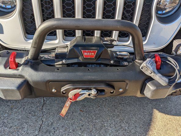 Install hook on winch line and re-spool the winch line.