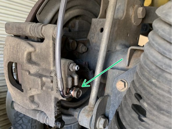 Install the factory banjo bolt in the Grimm OffRoad brake line. Use a new copper crush washer on each side of the brake line fitting.