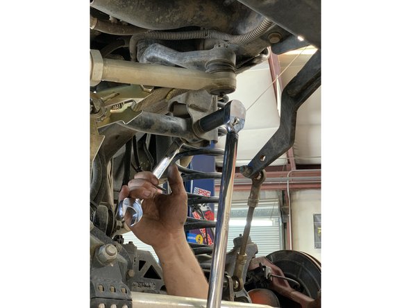 Make sure to hold onto the track bar so it doesn't drop out of the bracket.