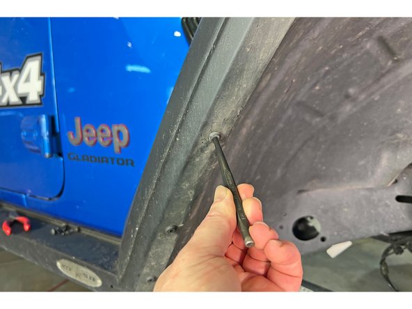 Remove the three push pins with your trim removal tool. One is at the front lower of the inner fender and two are at the rear lower of the inner fender.