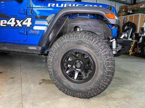 With a 22mm socket and torque wrench, torque the lug nuts in a star pattern to 130 lb-ft [176 N-m].