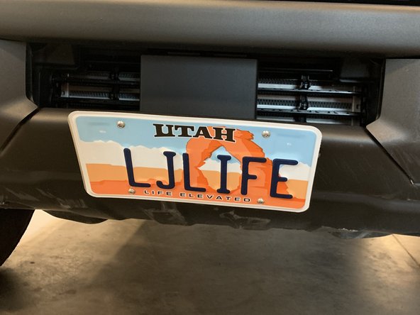 Place license plate over mounting bracket and install with the provided mounting hardware.