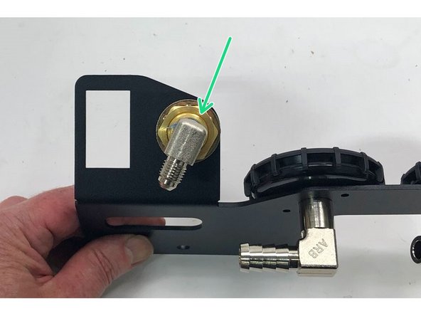 Install the 1/4” NPT x JIC4 90° elbow into the back of the bulkhead fitting on the switch bracket. Use thread sealant on the NPT threads and match the alignment of the fitting to the picture.