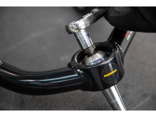 Apply grease to the inside and outside of the Hat Bushings, and slide them into the upper control arm pivot tubes.