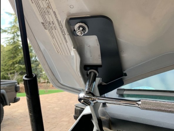 There is a left and right hood hinge light bracket. Make sure you have the correct bracket for the side you are installing. The brackets install from the center of the vehicle out, with the slots sliding over the hood studs as shown.