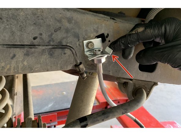 Insert the Grimm OffRoad brake line up through the newly installed brake line bracket on the frame and secure with the provided clip.