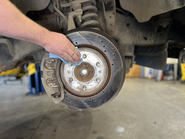 Wipe with a clean shop towel.