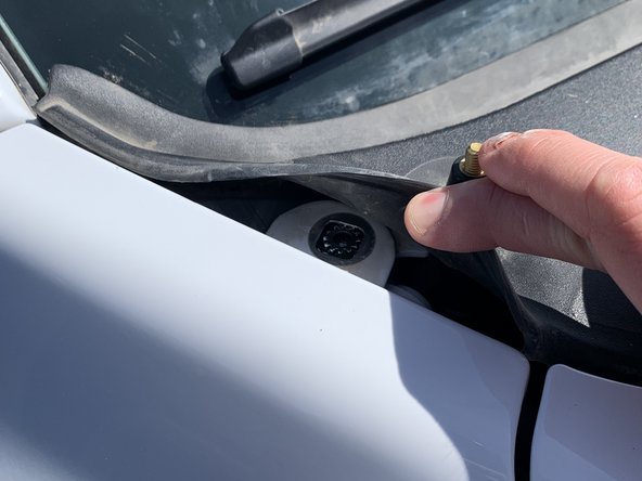 Lay the provided external lock tooth washer on top of the bolt hole in the fender followed by the Grimm OffRoad cowl light bracket and then the fender bolt.
