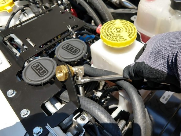 Install the other end of the included Stainless Steel Pressure Hose on to the brass bulkhead fitting on the Controls Plate.