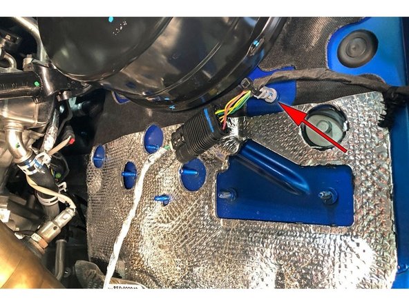 On the firewall, disconnect the wheel sensor plug.