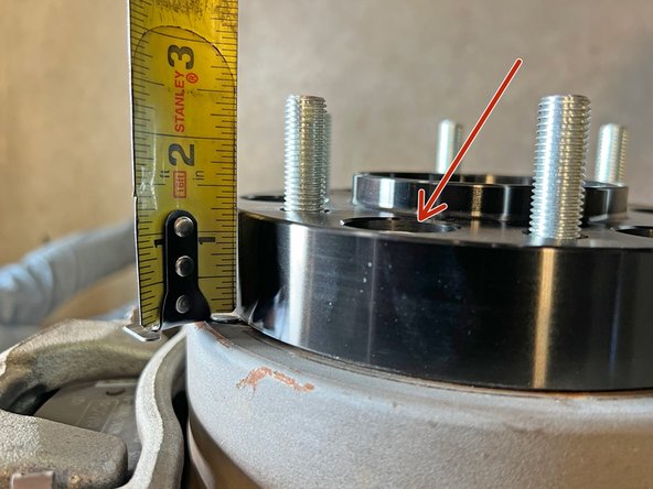 Check to make sure that the factory wheel studs are not protruding past the outer mounting surface of the wheel spacer. This can sometimes happen on thinner wheel spacers depending on the vehicle.