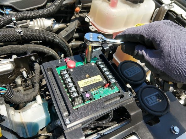 Connect the power wires to the sPOD module, noting that the circuit breaker is installed at the battery end.  Use a 3/8&quot; socket or wrench to tighten.