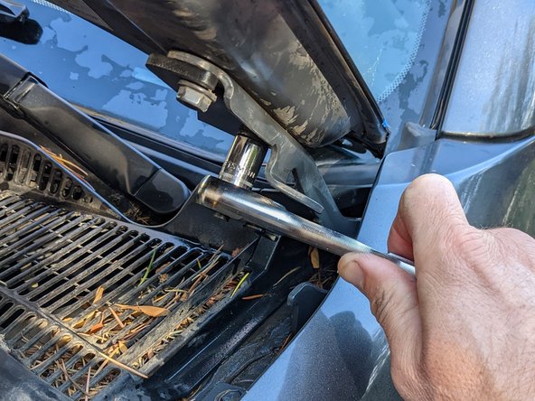 Snug the 12mm bolts so that the hood can still be moved if pushed on.